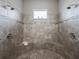 Large walk-in shower with double shower heads and built-in seat at 5159 Greens Dr, Lady Lake, FL 32159