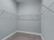Walk-in closet with wire shelving at 5159 Greens Dr, Lady Lake, FL 32159