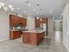 Modern kitchen with stainless steel appliances and an island at 5159 Greens Dr, Lady Lake, FL 32159