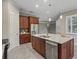 Modern kitchen with stainless steel appliances and an island at 5159 Greens Dr, Lady Lake, FL 32159