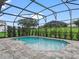 Relaxing screened pool with stone-paved patio at 5159 Greens Dr, Lady Lake, FL 32159
