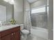 Clean bathroom with granite countertop and a bathtub at 5159 Greens Dr, Lady Lake, FL 32159