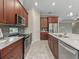 Modern kitchen with stainless steel appliances and ample cabinetry at 5159 Greens Dr, Lady Lake, FL 32159