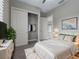 Bright bedroom with a walk-in closet and neutral decor at 5159 Greens Dr, Lady Lake, FL 32159