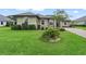 Beautiful two-story home with manicured lawn and paved driveway at 5159 Greens Dr, Lady Lake, FL 32159