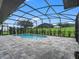 Inviting screened pool with ample deck space at 5159 Greens Dr, Lady Lake, FL 32159