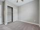 Spacious bedroom with plush carpet and ample closet space at 5159 Greens Dr, Lady Lake, FL 32159