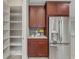 Walk-in pantry with ample shelving for storage at 5159 Greens Dr, Lady Lake, FL 32159