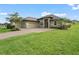 Charming house with three-car garage and beautifully landscaped yard at 5159 Greens Dr, Lady Lake, FL 32159