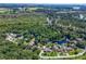 Aerial view showcasing home's waterfront location and neighborhood at 28432 Tammi Dr, Tavares, FL 32778