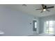 Bright living room featuring sliding glass doors and neutral wall colors at 3654 Caspian St, Leesburg, FL 34748