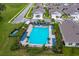 Community pool with lounge chairs and cabanas at 3654 Caspian St, Leesburg, FL 34748