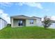House with backyard and sliding door at 3654 Caspian St, Leesburg, FL 34748
