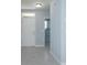 Entryway with tile flooring, leading to laundry room and front door at 3654 Caspian St, Leesburg, FL 34748