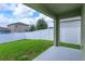 Fenced backyard with patio and grassy area at 3654 Caspian St, Leesburg, FL 34748