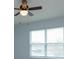 Bedroom with window and ceiling fan at 3654 Caspian St, Leesburg, FL 34748
