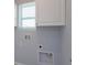 Laundry area with cabinets and hookups at 3654 Caspian St, Leesburg, FL 34748