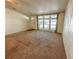 Spacious living room with large windows and carpeted floors at 1660 Elkhart Cir, Tavares, FL 32778