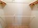 Walk-in closet with double hanging rods and shelving at 1660 Elkhart Cir, Tavares, FL 32778