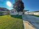 Single-story house with carport and landscaped yard at 1660 Elkhart Cir, Tavares, FL 32778