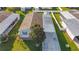 Aerial view of manufactured home with carport and surrounding homes at 1660 Elkhart Cir, Tavares, FL 32778