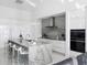 Luxurious kitchen boasting marble countertops, stainless steel appliances, and an eat-in island at 15617 Pendio Dr, Bella Collina, FL 34756