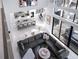 Open concept main living area showcasing the kitchen, living room, and dining area from above at 15617 Pendio Dr, Bella Collina, FL 34756