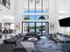 Open living space with water view and fireplace at 15617 Pendio Dr, Bella Collina, FL 34756