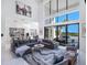L-Shaped sectional sofa in living room overlooking pool at 15617 Pendio Dr, Bella Collina, FL 34756