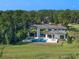 Luxury home boasting a large pool and lush landscaping at 15617 Pendio Dr, Bella Collina, FL 34756