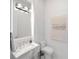 Powder room with marble vanity and modern fixtures at 15617 Pendio Dr, Bella Collina, FL 34756