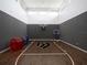 Indoor basketball court with hardwood flooring, a hoop, and bumper balls at 15617 Pendio Dr, Bella Collina, FL 34756