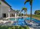 Resort-style pool with spa and outdoor kitchen at 15617 Pendio Dr, Bella Collina, FL 34756