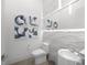 Powder room with modern sink and wave tile at 15617 Pendio Dr, Bella Collina, FL 34756