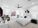 Spacious bedroom with a white upholstered bed and large windows at 15617 Pendio Dr, Bella Collina, FL 34756