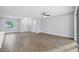 Open floorplan living room with tile floors and a view of the front door at 577 Dowling Cir, Lady Lake, FL 32159