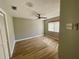 Bedroom featuring wood-look flooring and a ceiling fan at 39331 Treeline Dr, Lady Lake, FL 32159