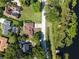 Aerial view of lakefront home and lot at 687 W Lakeshore Dr, Clermont, FL 34711