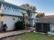 Two-story house with a metal roof and a spa in the backyard at 101 S Dixie Ave, Fruitland Park, FL 34731