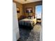 Spacious bedroom with a full-size bed and a dark wood frame at 101 S Dixie Ave, Fruitland Park, FL 34731