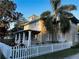 Beautiful two-story home with white picket fence at 101 S Dixie Ave, Fruitland Park, FL 34731