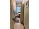 Bathroom with tiled floor, shower, and window at 101 S Dixie Ave, Fruitland Park, FL 34731