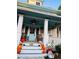 Spacious front porch decorated for Halloween with pumpkins and fall decor at 101 S Dixie Ave, Fruitland Park, FL 34731