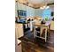 Modern kitchen with a center island, stainless steel appliances, and light-colored cabinets at 101 S Dixie Ave, Fruitland Park, FL 34731