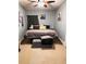 Spacious bedroom with a king-size bed and neutral decor at 101 S Dixie Ave, Fruitland Park, FL 34731