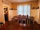 Bright dining room with hardwood floors and built-in shelving at 101 S Dixie Ave, Fruitland Park, FL 34731