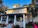 Charming two-story home with a welcoming front porch at 101 S Dixie Ave, Fruitland Park, FL 34731