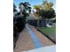 Large backyard with a pool and a walkway at 101 S Dixie Ave, Fruitland Park, FL 34731