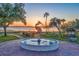 Picturesque fountain with heron sculpture at sunset at 1240 Tangerine Ct, Eustis, FL 32726