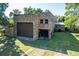 Brick house exterior with large garage door at 1240 Tangerine Ct, Eustis, FL 32726